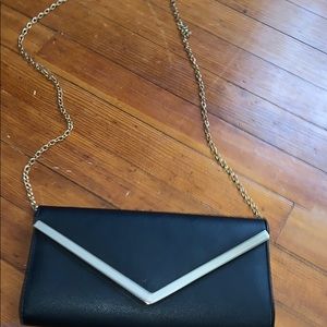 Black and gold Aldo clutch/ cross body bag